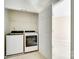 Laundry room with a washer, dryer, and wire shelving at 349 Valley Brook Se Ln, Concord, NC 28025
