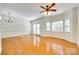 Spacious living room with hardwood floors, lots of light, and modern ceiling fan and lighting at 349 Valley Brook Se Ln, Concord, NC 28025
