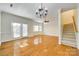Spacious living room with hardwood floors, natural light, and stairs at 349 Valley Brook Se Ln, Concord, NC 28025