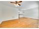 Bright, open living room flows into a kitchen with bar and hardwood flooring at 349 Valley Brook Se Ln, Concord, NC 28025