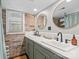 Bright bathroom with double sinks and large mirrors, featuring exposed brick accents at 364 Catalina Dr, Mooresville, NC 28117