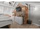 Cozy bedroom features a brick accent wall, adding character and warmth to the space at 364 Catalina Dr, Mooresville, NC 28117