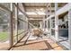 Inviting dining area within screened porch boasts ample seating and views of the backyard and lake at 364 Catalina Dr, Mooresville, NC 28117