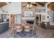 Stylish dining area boasts a brick fireplace and seamless flow to living spaces, perfect for entertaining guests at 364 Catalina Dr, Mooresville, NC 28117