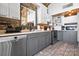Rustic kitchen features granite countertops, modern appliances, and exposed brick accents at 364 Catalina Dr, Mooresville, NC 28117