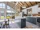 Kitchen featuring an island with granite countertop and sliding glass doors to the lanai at 364 Catalina Dr, Mooresville, NC 28117