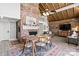 Living and dining area featuring a brick fireplace, open layout, and rustic charm at 364 Catalina Dr, Mooresville, NC 28117