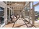 Relaxing screened porch features comfortable seating and a peaceful atmosphere for outdoor living and entertaining at 364 Catalina Dr, Mooresville, NC 28117