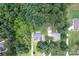Overhead view of a home with mature tree coverage offering shade and privacy in a developed neighborhood at 3874 Willow Grove Ln, Concord, NC 28025