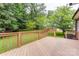 Relaxing back deck overlooking a lush green lawn and mature trees at 3874 Willow Grove Ln, Concord, NC 28025
