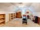 Spacious bonus room with a ceiling fan, carpeted floors, and built in shelving at 3874 Willow Grove Ln, Concord, NC 28025