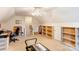 Carpeted bonus room with a ceiling fan, a work station, and built-in storage at 3874 Willow Grove Ln, Concord, NC 28025