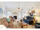 Bright living room with a fireplace and access to the outdoors at 3874 Willow Grove Ln, Concord, NC 28025