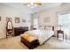 Bright main bedroom with large bed and beautiful furnishings at 3874 Willow Grove Ln, Concord, NC 28025