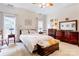 Spacious main bedroom with tray ceilings, two windows, and beautiful furnishings at 3874 Willow Grove Ln, Concord, NC 28025