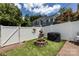 Well-maintained backyard with fire pit, grill, privacy fence and manicured lawn area at 432 W Worthington Ave, Charlotte, NC 28203