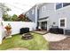 Cozy backyard featuring a fire pit, fenced in privacy, and patio, creating a perfect space for outdoor activities at 432 W Worthington Ave, Charlotte, NC 28203