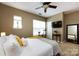 Neutral toned bedroom features a ceiling fan, exercise bike, and mirror at 432 W Worthington Ave, Charlotte, NC 28203