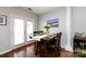 Charming dining area with warm wood floors, an attractive wood table and chairs, and views to the side yard at 432 W Worthington Ave, Charlotte, NC 28203