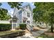 Charming multi-story home features a well-maintained front yard and inviting entrance with classic architectural detail at 432 W Worthington Ave, Charlotte, NC 28203
