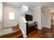 The entry foyer offers warm wood flooring and access to the staircase at 432 W Worthington Ave, Charlotte, NC 28203