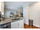 Open kitchen area with granite countertops, stainless steel sink, and modern fixtures at 432 W Worthington Ave, Charlotte, NC 28203