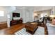 Open-concept living area featuring hardwood floors, modern decor, and seamless flow to the kitchen and dining spaces at 432 W Worthington Ave, Charlotte, NC 28203
