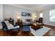 Tastefully decorated living room featuring a plush sofa, accent chairs, and stylish decor, creating a comfortable atmosphere at 432 W Worthington Ave, Charlotte, NC 28203