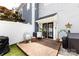 Private patio area featuring a cozy seating area, grill, and stylish decor for outdoor relaxation and entertaining at 432 W Worthington Ave, Charlotte, NC 28203