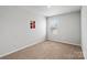 Minimalist bedroom with neutral carpet, a window, and simple decorations at 517 Morrows Turnout Way, Pineville, NC 28134