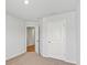 Neutral bedroom with large closet door visible through open door at 517 Morrows Turnout Way, Pineville, NC 28134