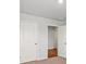 Hallway with neutral walls, carpet, and wood flooring in the connected room, all illuminated by recessed lighting at 517 Morrows Turnout Way, Pineville, NC 28134