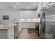 Modern kitchen with granite countertops and stainless steel appliances at 517 Morrows Turnout Way, Pineville, NC 28134