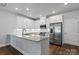 Modern kitchen with granite countertops and stainless steel appliances at 517 Morrows Turnout Way, Pineville, NC 28134