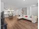 Open-concept living room featuring hardwood floors and modern décor at 517 Morrows Turnout Way, Pineville, NC 28134