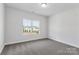Bright bedroom with neutral carpet, a large window, and ample natural light at 5244 Admirals Lndg, Lancaster, SC 29720
