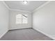 Bright bedroom with large window, soft carpet, and neutral paint creating a calm atmosphere at 5244 Admirals Lndg, Lancaster, SC 29720