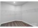 Walk-in closet with carpet flooring and wire shelving, offering ample storage space at 5244 Admirals Lndg, Lancaster, SC 29720