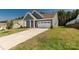 A stunning home with a well-maintained lawn and a spacious driveway leading to a garage at 5244 Admirals Lndg, Lancaster, SC 29720