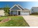 Charming home features a welcoming front porch and a well-manicured lawn, perfect for curb appeal at 5244 Admirals Lndg, Lancaster, SC 29720