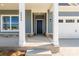 Inviting front porch with stone accents and a stylish dark-colored front door at 5244 Admirals Lndg, Lancaster, SC 29720