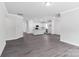 Open living space showcasing a modern kitchen with an island and a spacious, neutral room at 5244 Admirals Lndg, Lancaster, SC 29720