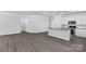 Open-concept with white cabinets, modern appliances, and large island with sleek countertops at 5244 Admirals Lndg, Lancaster, SC 29720