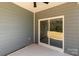 Covered patio with sliding glass doors, offering an outdoor living space at 5244 Admirals Lndg, Lancaster, SC 29720
