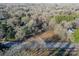 An aerial view displays the property and the lot cleared and ready for building in a quiet wooded neighborhood at 531 Winding Way # 9, Belmont, NC 28012