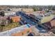 Aerial view shows city's charming buildings, street parking and vibrant shops with the backdrop of a clear blue sky at 531 Winding Way # 9, Belmont, NC 28012