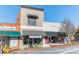 A commercial building that houses a bookshop, with awning, sits among other businesses in the quaint town at 531 Winding Way # 9, Belmont, NC 28012