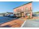 Captured is a commercial building with red brick, sidewalk parking and a crosswalk leading to other businesses at 531 Winding Way # 9, Belmont, NC 28012