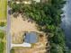 Top-down aerial perspective reveals a home on a spacious plot of land, bordering a dense forest and a still lake at 537 Riddle Mill Rd, Clover, SC 29710