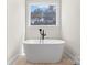 Luxurious bathroom featuring a freestanding soaking tub with modern black fixtures at 537 Riddle Mill Rd, Clover, SC 29710